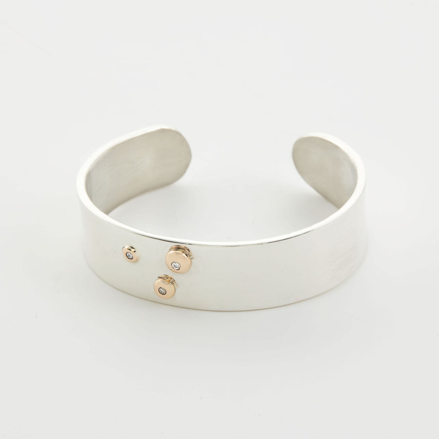 Silver Bangel With Gold Setting And Diamonds.